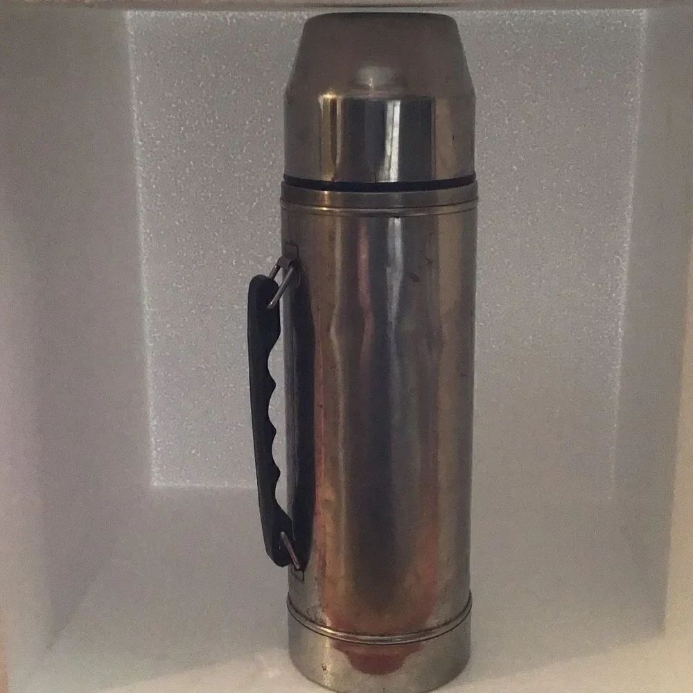 Vintage Uno-vac stainless thermos with patina and a little ding